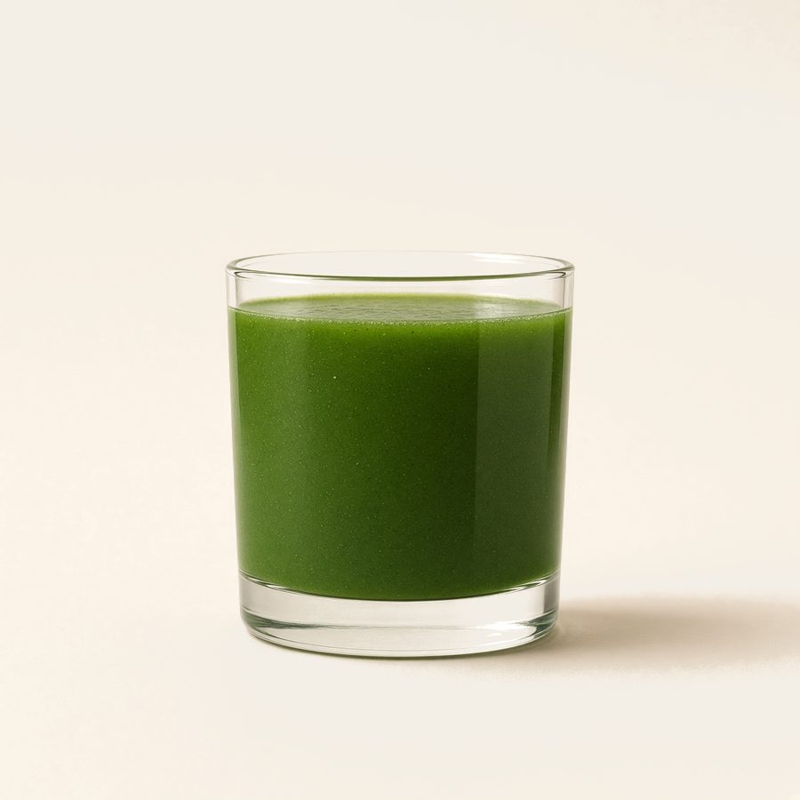 A short glass of deep green drink